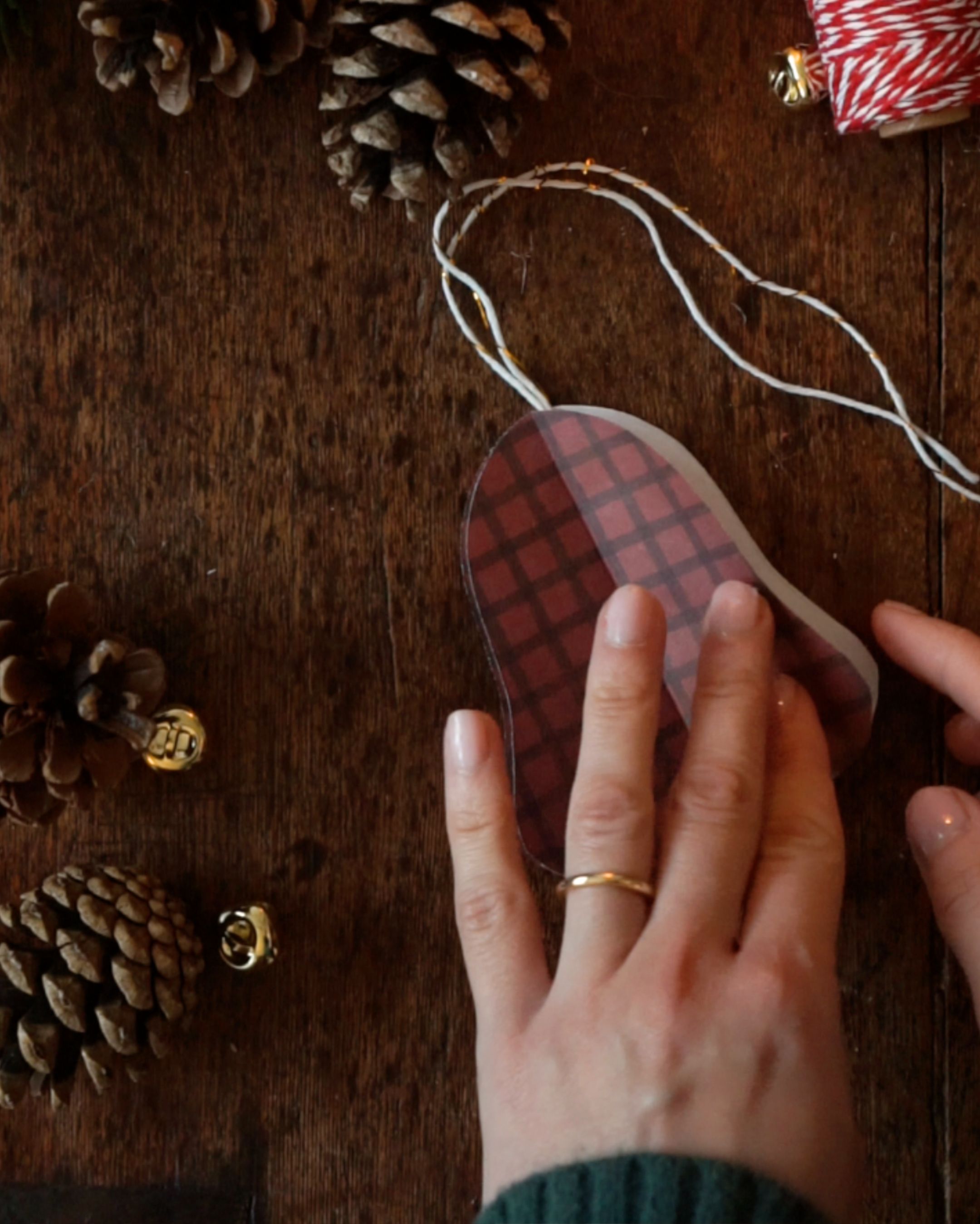DIY Paper Bell Ornaments Step 8 Sealing the bell together.