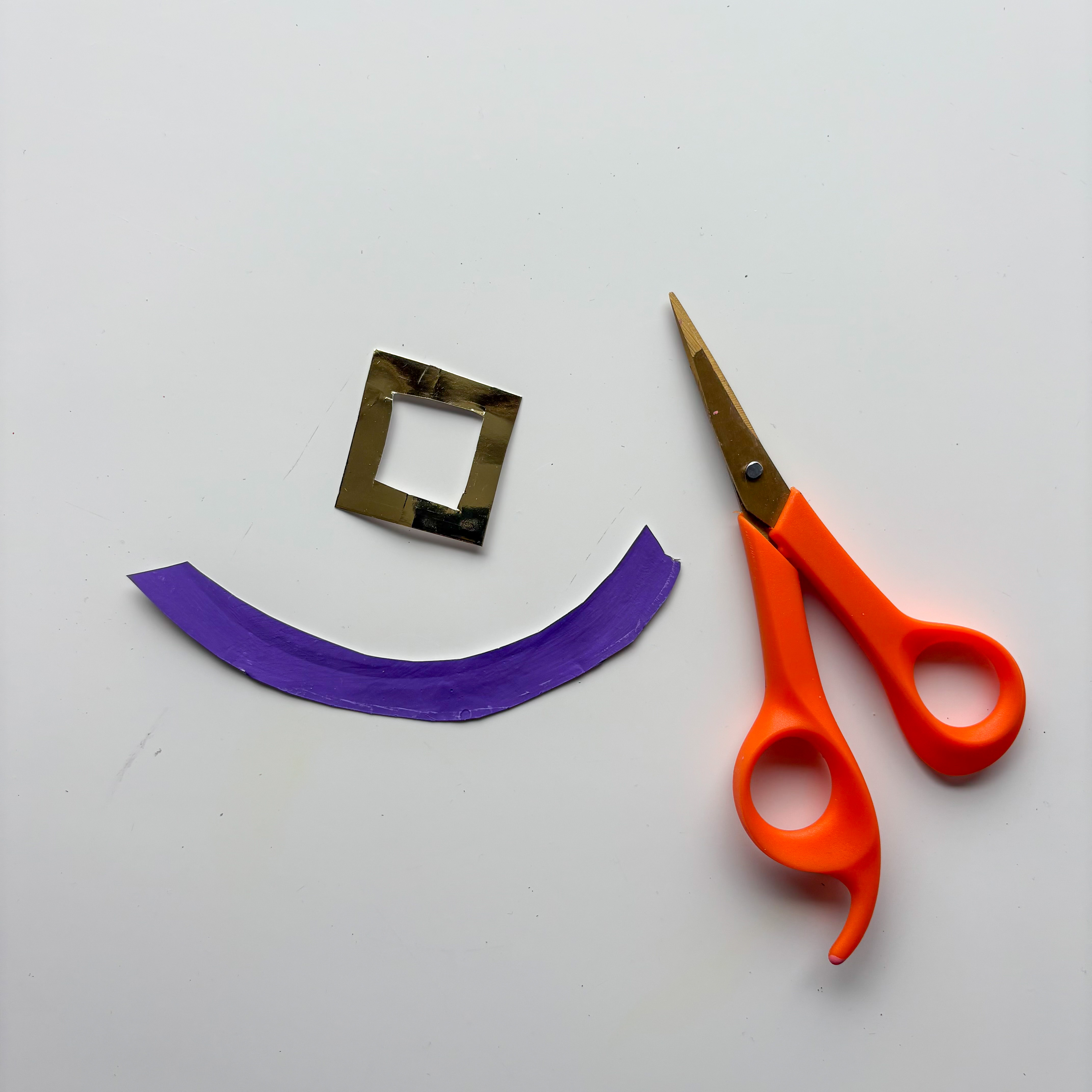 Cut out a strip of coloured paper for the hat band - orange, purple, or green look great! 