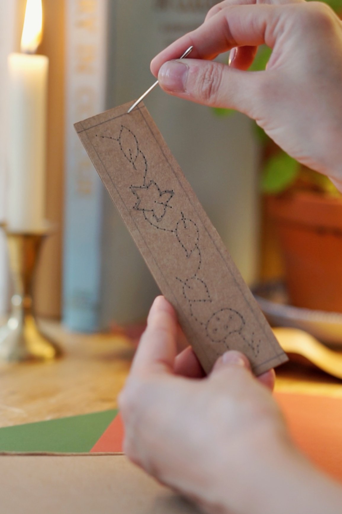 Needle points to the border on the bookmark.