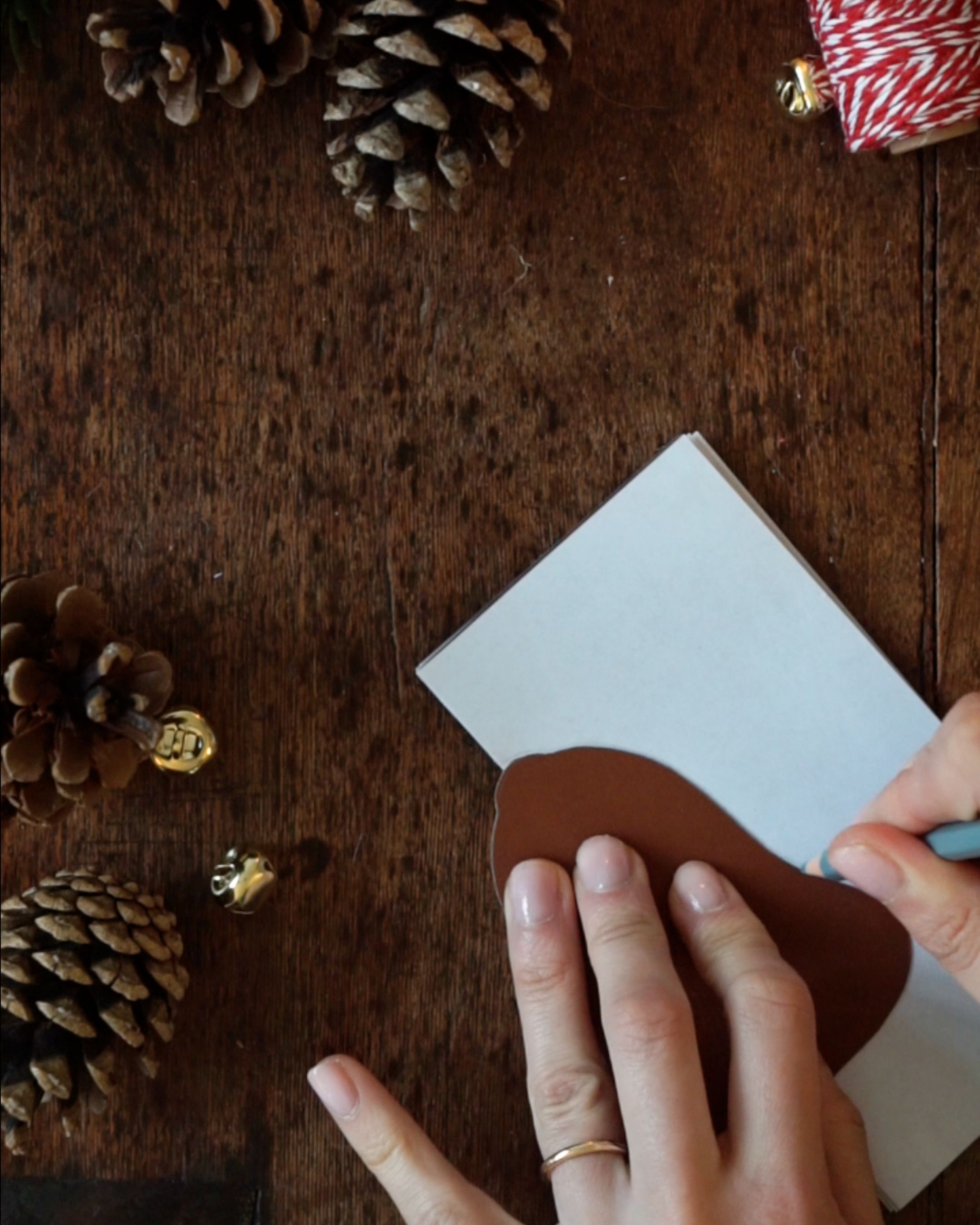 DIY Paper Bell Ornaments Step 4 Tracing the bell stencil.