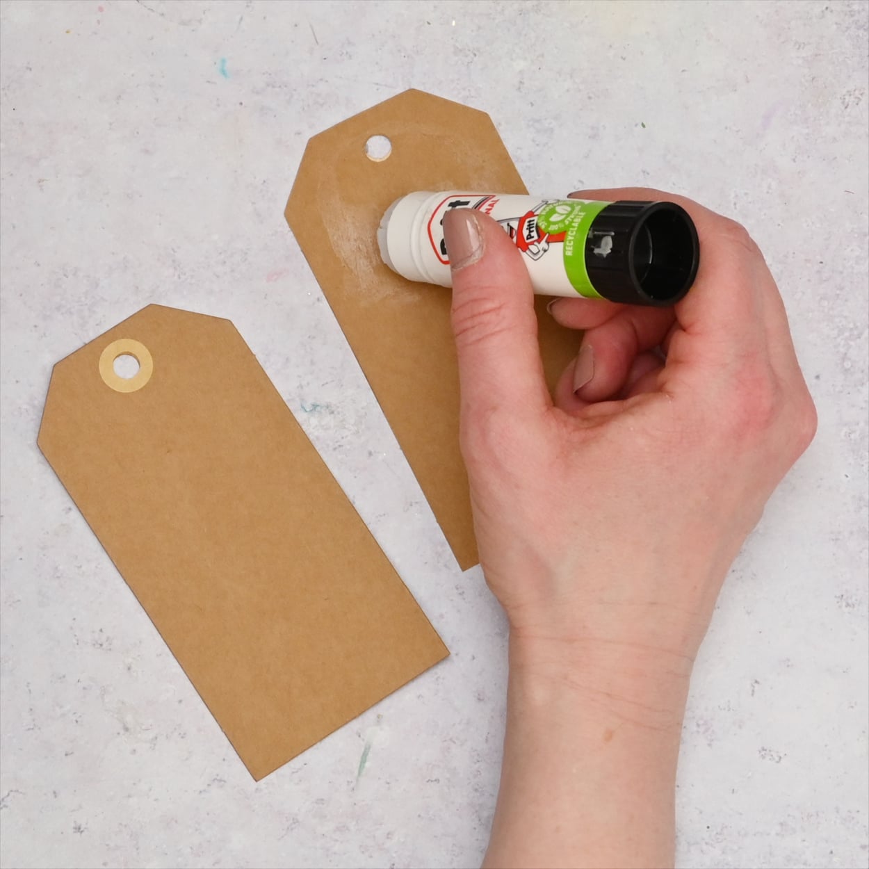 Glue stick on luggage tag.