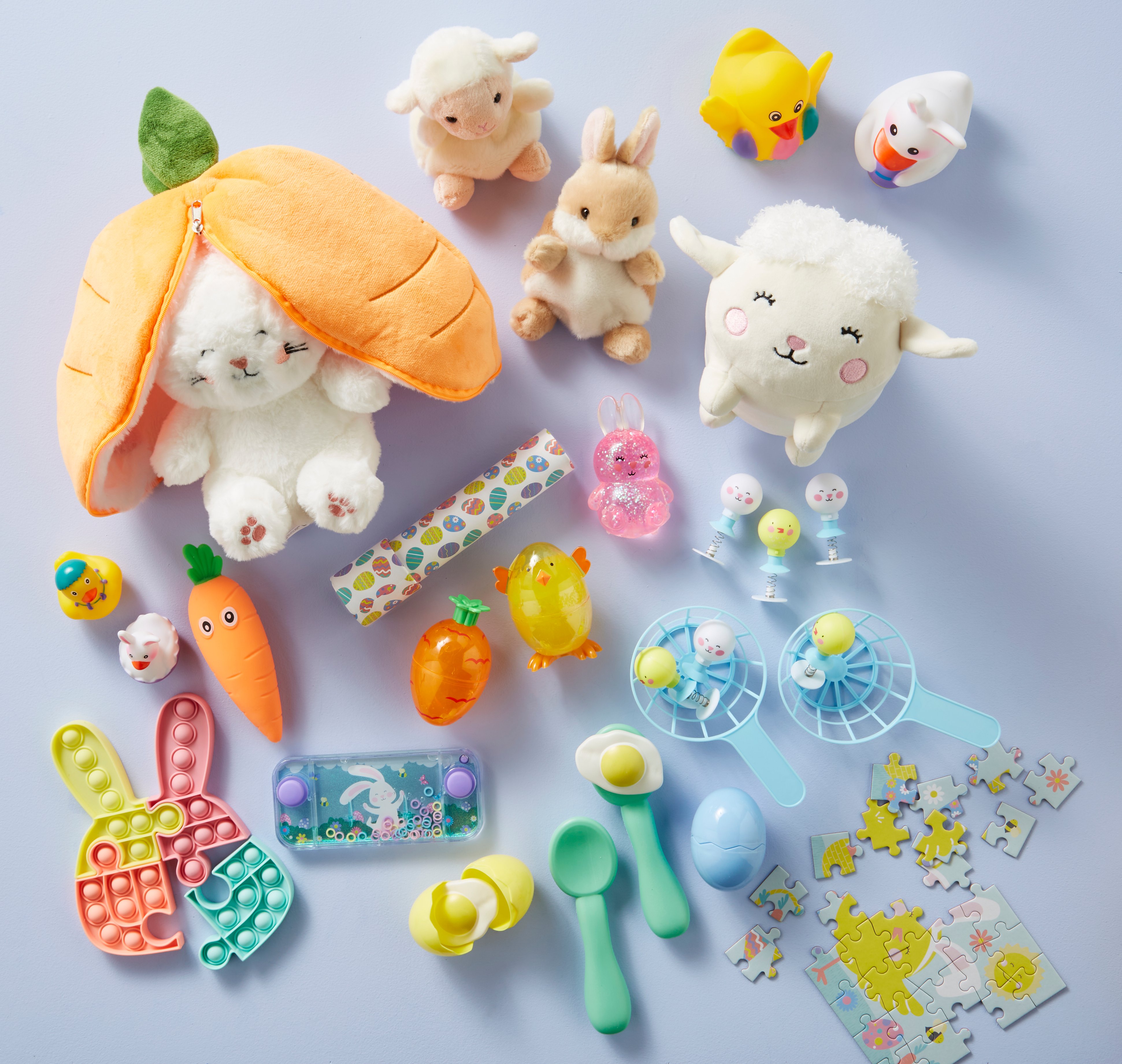 Flat lay image of Easter plush and other novelty toys and games.