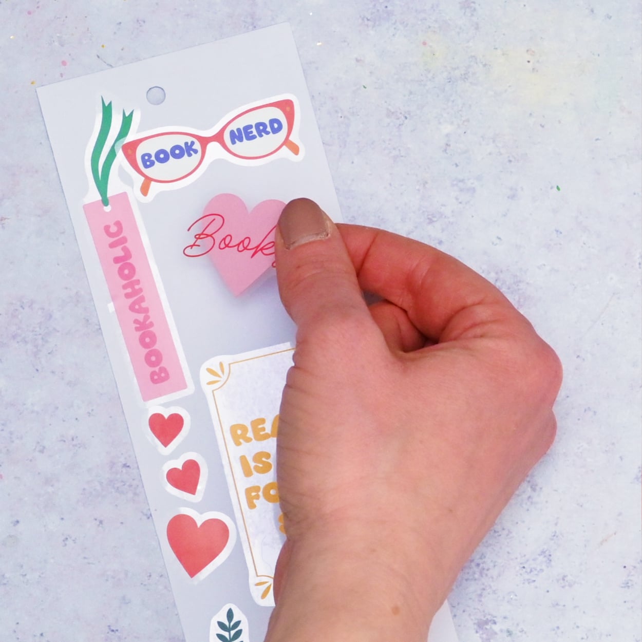 Reading stickers on card.