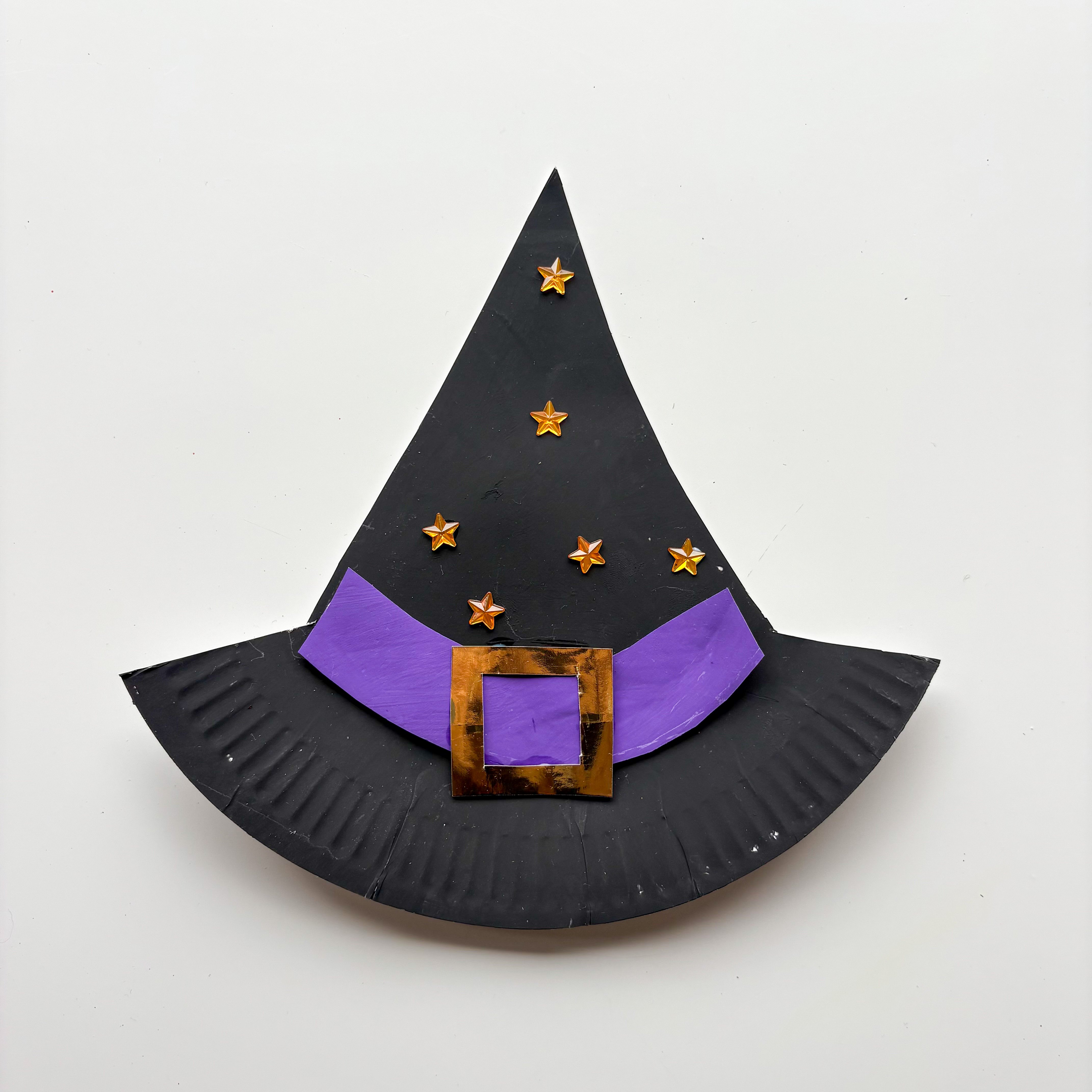 Cut out a strip of coloured paper for the hat band - orange, purple, or green look great! 