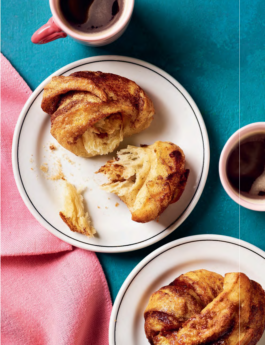 Air Fryer Cinnamon Buns Close-up of a sweet air fryer cinnamon bun with golden tops and swirls of cinnamon sugar.