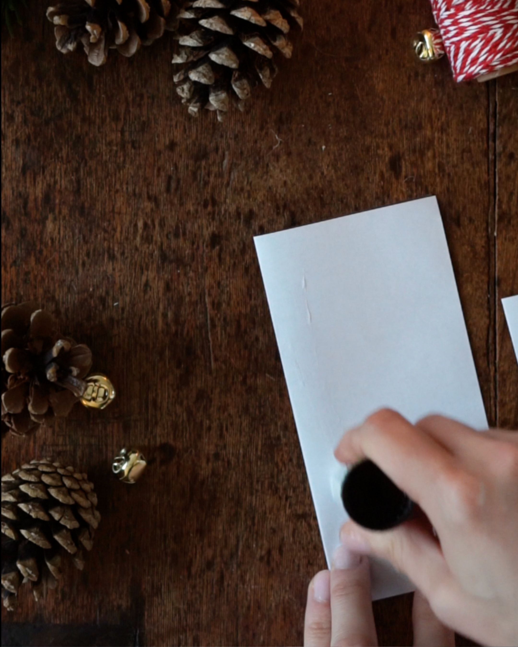 DIY Paper Bell Ornaments Step 2 Glue the piece of paper.