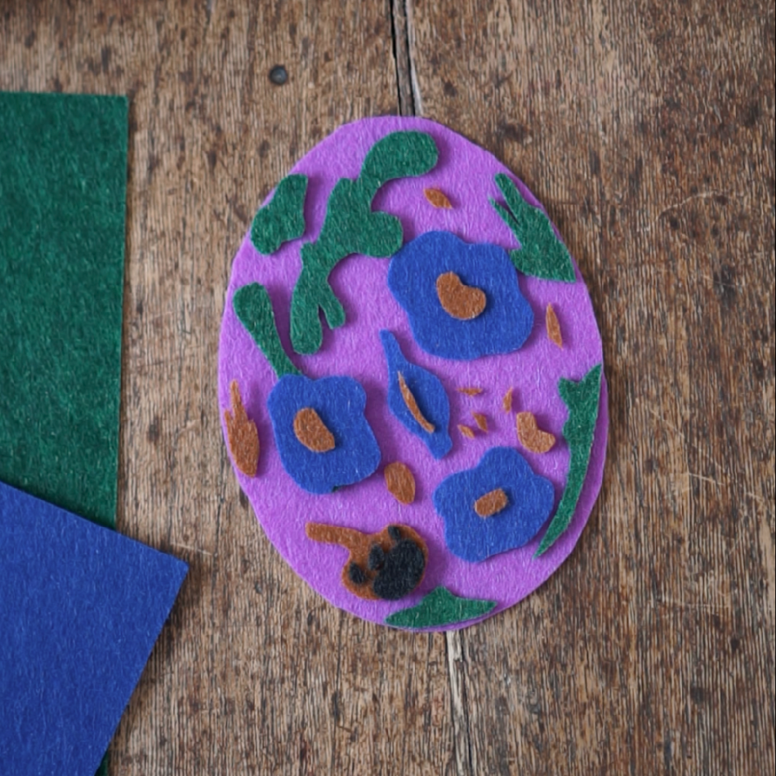Step 2: Start with the Largest Shape Scissors cutting out felt around the shape form the colouring page.#