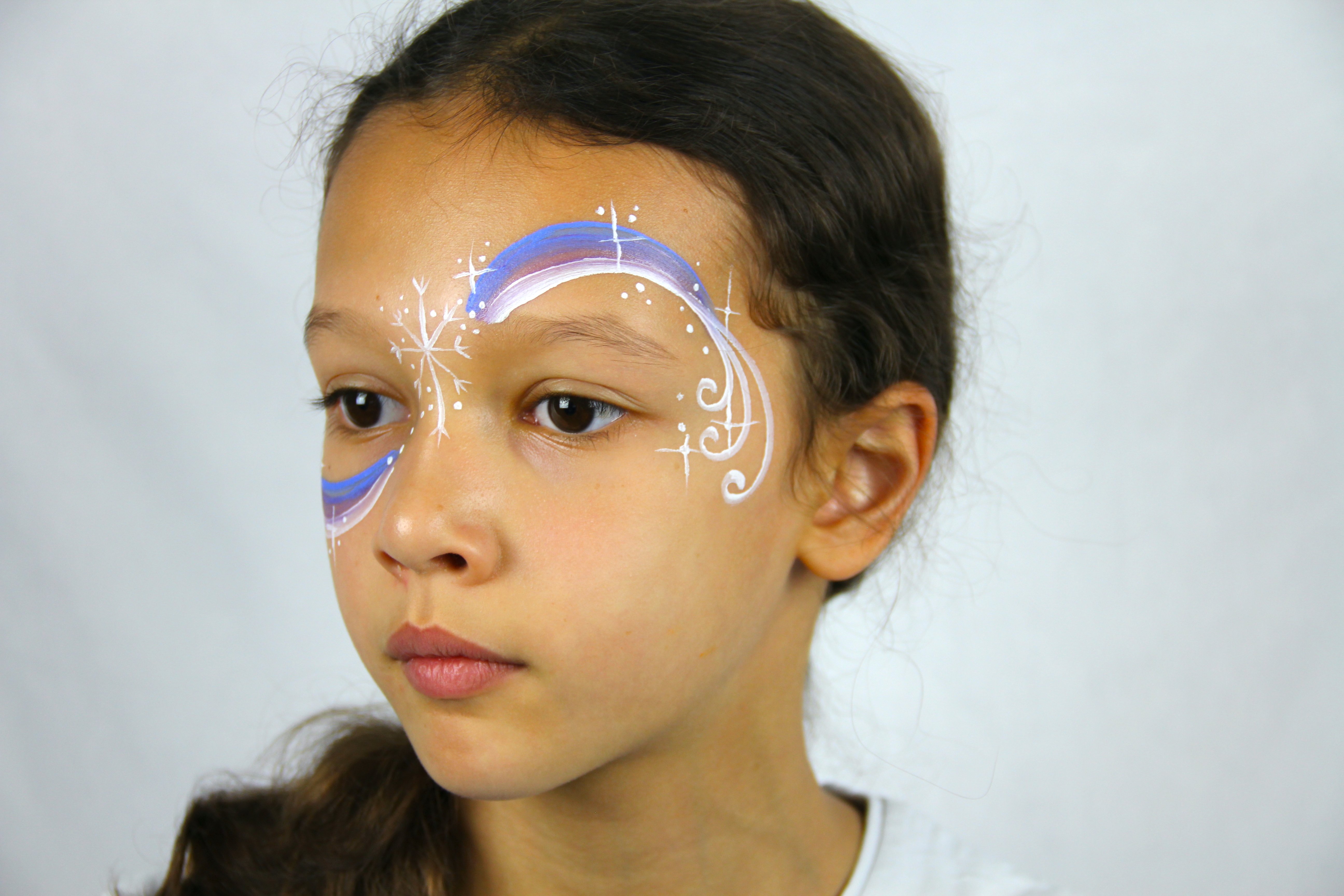 Paint lots of stars, dots, and sparkles to create a festive swirl.